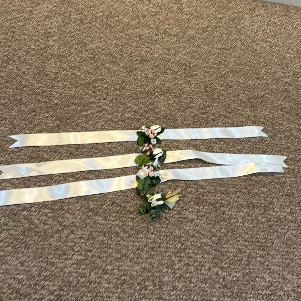 Wedding flowers.  One boutonnière and 3 wrist corsages, hand made